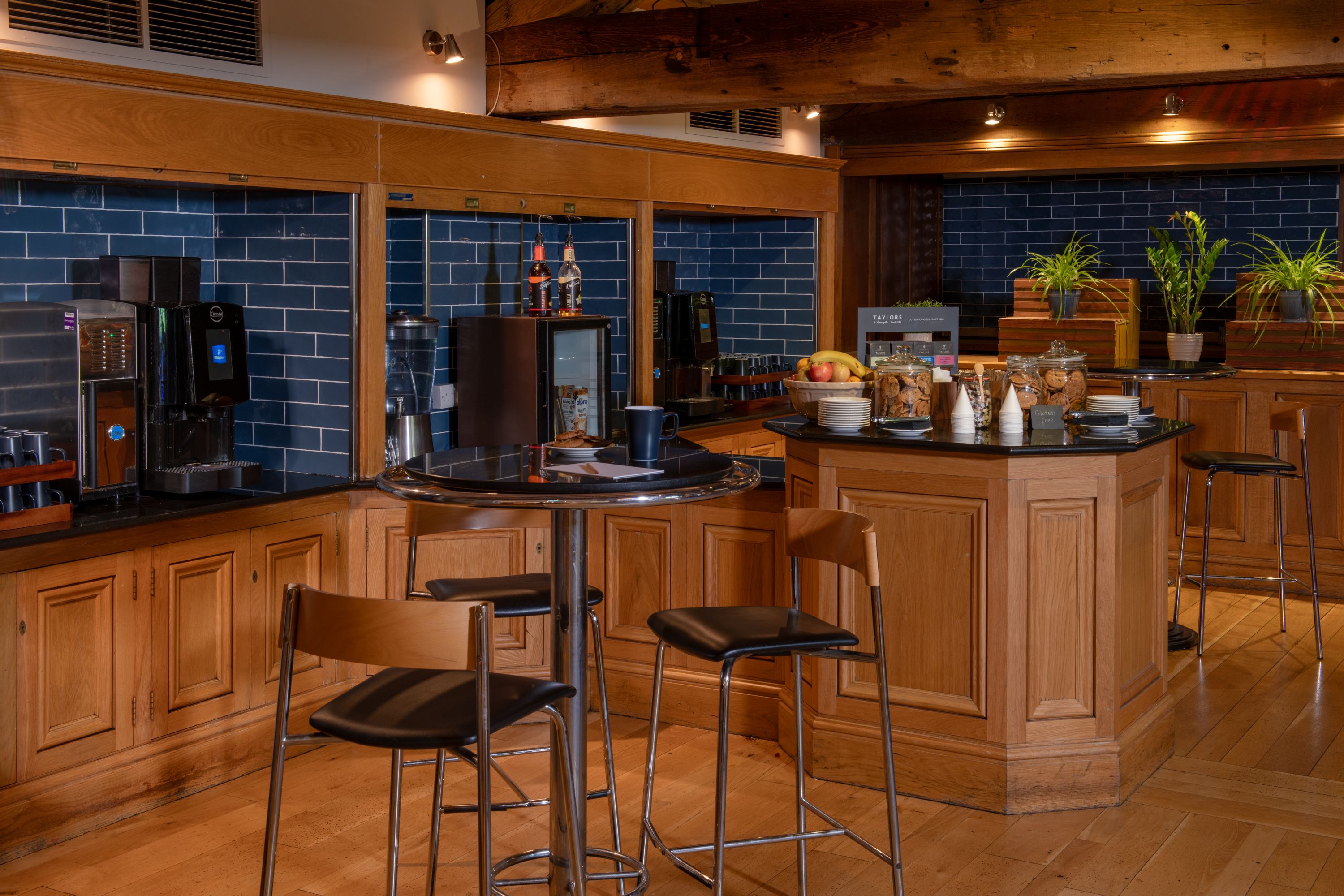 A work space with tea, coffee and light nibbles