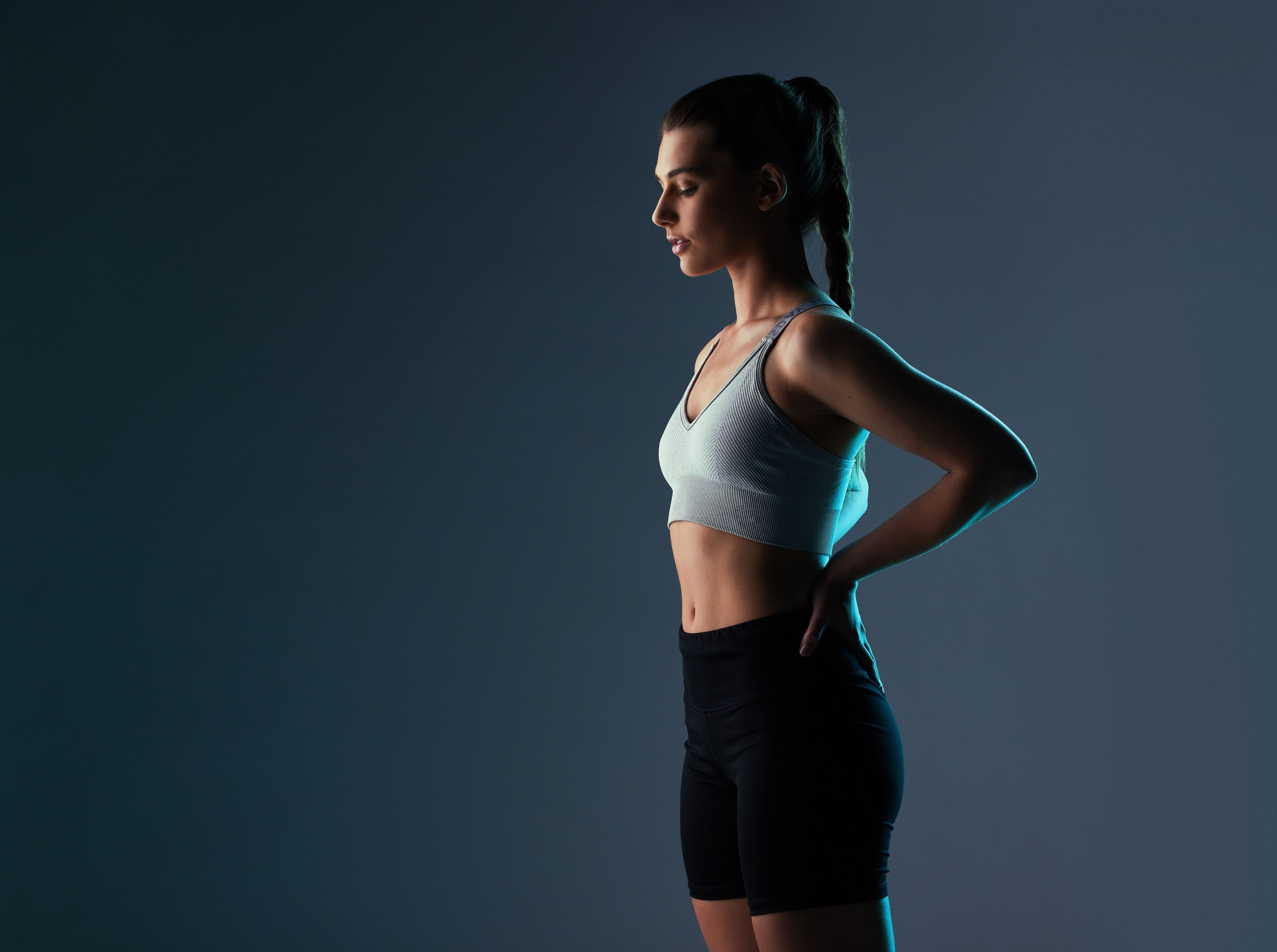 Women in fitness attire with hands on hips