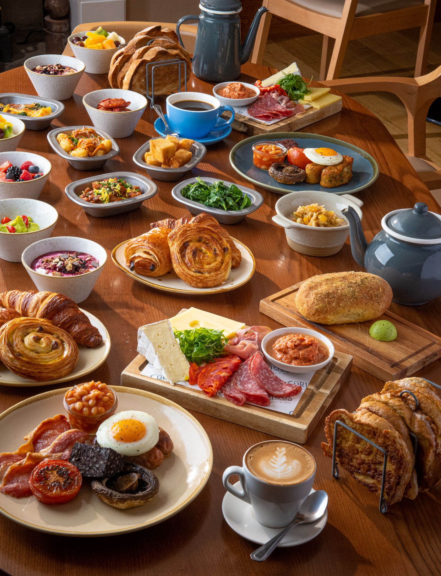 table with different breakfast dishes