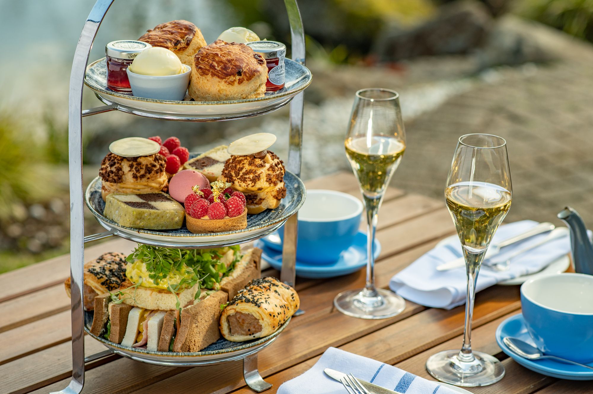 Afternoon tea with prosecco in an outdoors table