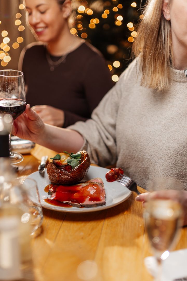 Woman enjoying Christmas dinner