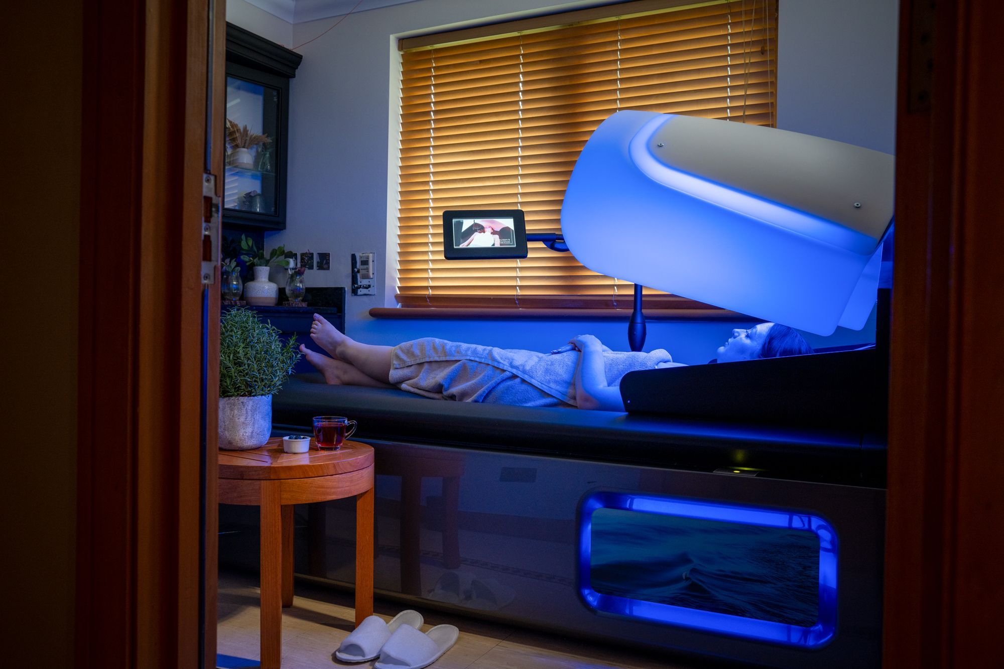 Woman using WaveTouch massage bed